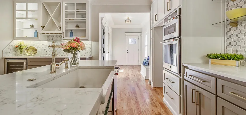 Bright custom kitchen with white stone countertops
