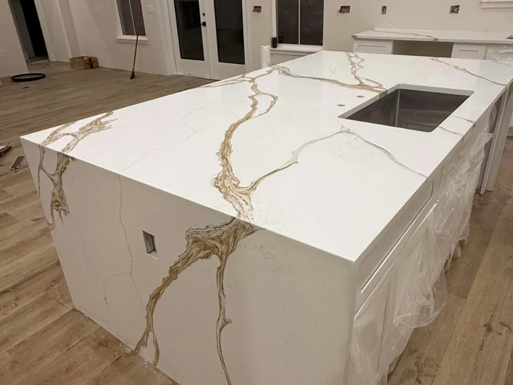 Completed waterfall kitchen island with dramatic veining